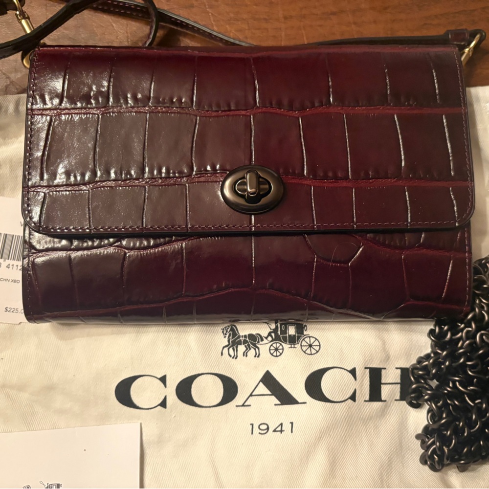 Coach clutch/ wallet on a chain in embossed oxbood.